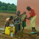 children collecting water